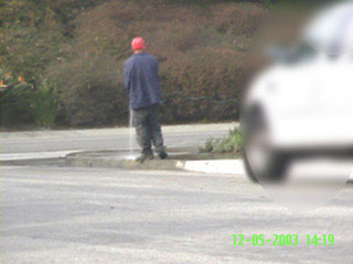 Fernando hosing the Wilson sidewalk